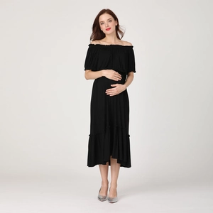 Detail of a black off-shoulder maternity midi dress with ruffled hem and elastic neckline