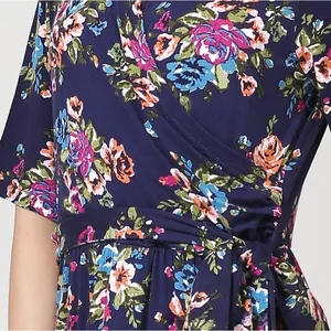 Detail of floral maternity wrap dress showing V-neckline and adjustable waist tie