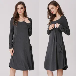Detail of grey maternity nursing dress showing hidden breastfeeding openings and soft fabric