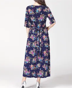 Back view of a navy blue floral maternity dress with waist tie and colorful prints