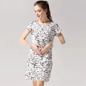 Detail of floral printed nursing dress showing soft cotton fabric and waist pleats