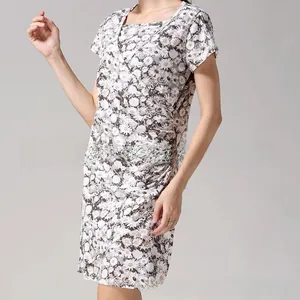 Detailed view of daisy floral print on nursing dress with side ruching and v-neckline
