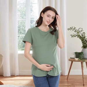 Close-up of green short sleeve cotton nursing t-shirt with functional hidden zipper