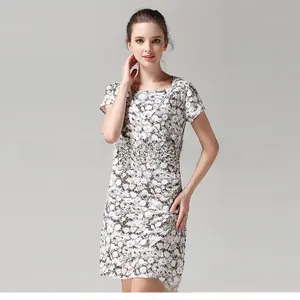 Detail of elegant V-neck nursing dress featuring daisy floral print and soft cotton fabric