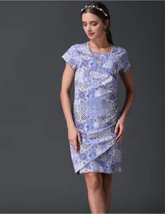 Detail of V-neck nursing dress featuring blue floral geometric prints and cotton fabric