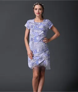 Detail of V-neck nursing dress with blue geometric tile pattern and short sleeves