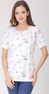 Close-up of white cotton maternity shirt with blue nautical sailboat print pattern