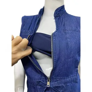 Detail view of dark blue denim maternity dress with front zipper and soft inner lining