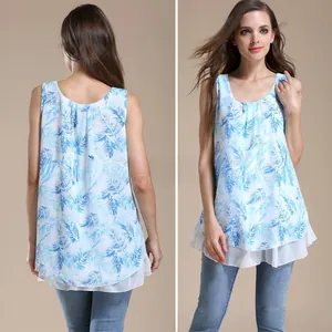 Detail of summer sleeveless maternity top featuring blue palm leaf print and chiffon hem