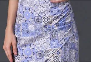 Detail view showing blue floral patterns and side ruched design on the nursing dress