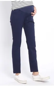 Detailed view of high-waisted maternity trousers with elastic belly support in dark blue