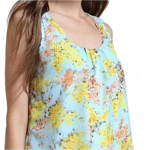 Close-up of summer floral chiffon maternity nursing top with light blue abstract print