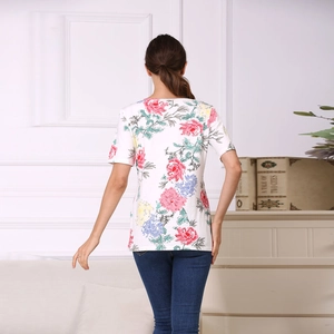 Detail view of floral print on back of white cotton nursing T-shirt for pregnant women