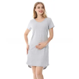 Detail view of a grey cotton maternity dress featuring short sleeves and a nursing design
