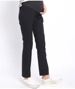 Close-up of the elastic high-waisted maternity support band on black lounge pants