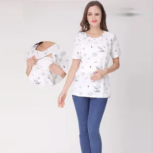 Detail of the side-opening nursing access on a white cotton maternity t-shirt