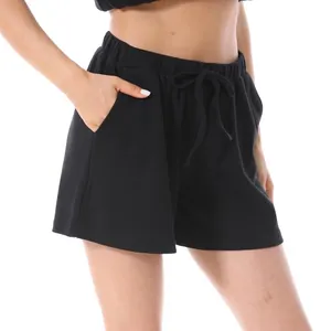 Women's black waffle knit high-waisted wide-leg shorts with adjustable drawstring waist