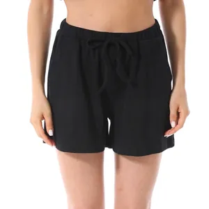 Women's black waffle knit shorts with elastic drawstring waist in a loose casual style