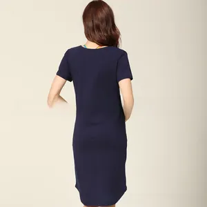 Back view of a navy blue cotton maternity nursing dress showing simple straight cut design