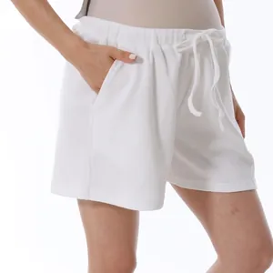 White waffle knit wide-leg maternity shorts with high elastic waist and drawstring