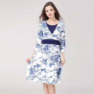 Floral V-neck maternity nursing dress with blue leaf print and three-quarter sleeves