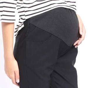 High-waisted black maternity trousers with belly support band for autumn fashion