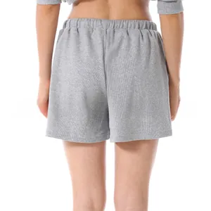 Rear view detail of soft grey cotton lounge shorts with wide elastic waistband texture