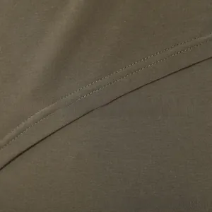Detail shot of olive green maternity tank top with fine knit texture and neat double-needle stitching