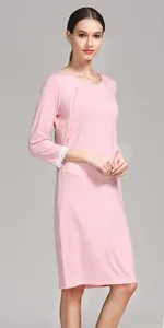 Close-up of pink maternity nursing dress with lace cuffs and breastfeeding design