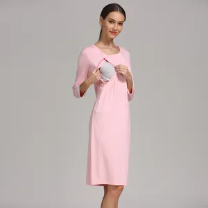 Detail of pink maternity nursing dress with hidden zipper opening and lace cuffs