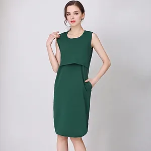 Detail of dark green sleeveless maternity dress with nursing slits and side pockets