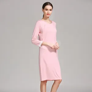 Detail of soft pink maternity dress with hidden breastfeeding opening and lace cuffs