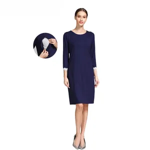 Detail of invisible nursing zippers on dark blue maternity dress with lace cuffs
