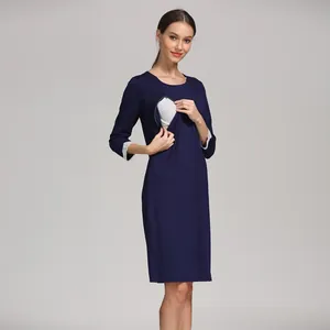 Detail of hidden nursing zipper on navy modal maternity dress with lace cuffs
