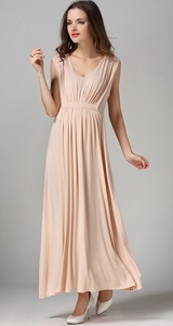 Macro view of apricot pleated sleeveless maternity dress with deep V-neck and high waistline