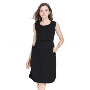 Detail of black sleeveless maternity dress featuring a practical double-layer nursing design