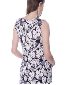 Detail view of navy cotton maternity dress featuring white tropical leaf prints and open back