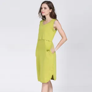 Lime green sleeveless cotton maternity dress with double-layered nursing access and side pockets
