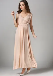 Close-up of the delicate high-waist pleats and soft pink modal fabric of the maternity dress