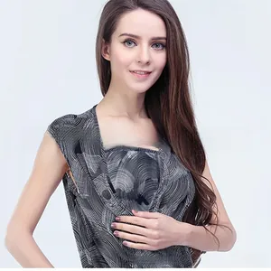 Detail of V-neck maternity jumpsuit featuring black and white concentric wave patterns