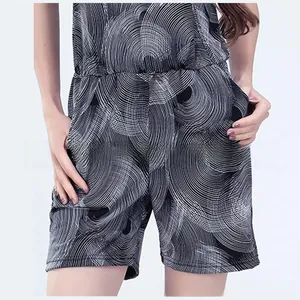 Close-up of maternity jumpsuit with black and white geometric print and side pockets