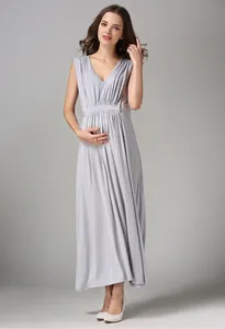 Macro shot of grey modal maternity dress with V-neckline and high waist pleated details