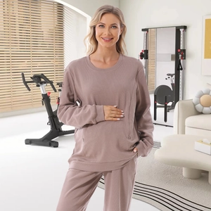 Fashionable maternity tracksuit set with a nursing sweatshirt and wide-leg jogger pants