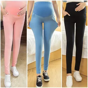 Detail shot showing the high elasticity and stretch of the maternity leggings fabric