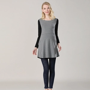 Close-up of maternity top featuring grey knit body and contrasting black long sleeves