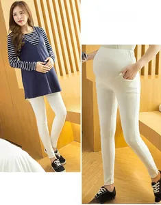 Detail showing high-waist support band and side pocket on maternity leggings