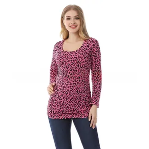 Close-up of pink leopard print nursing top with elastic cotton texture and crew neckline