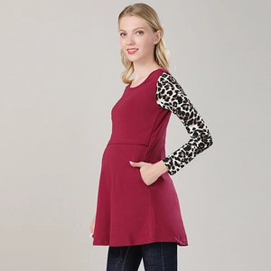 Long-sleeved maternity top in burgundy with leopard print sleeves and side pockets