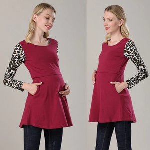 Detail of burgundy maternity nursing top with leopard print sleeves and hidden nursing opening