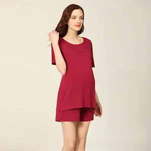 Close-up of the dark red Modal fabric and elastic waist on these maternity pajamas